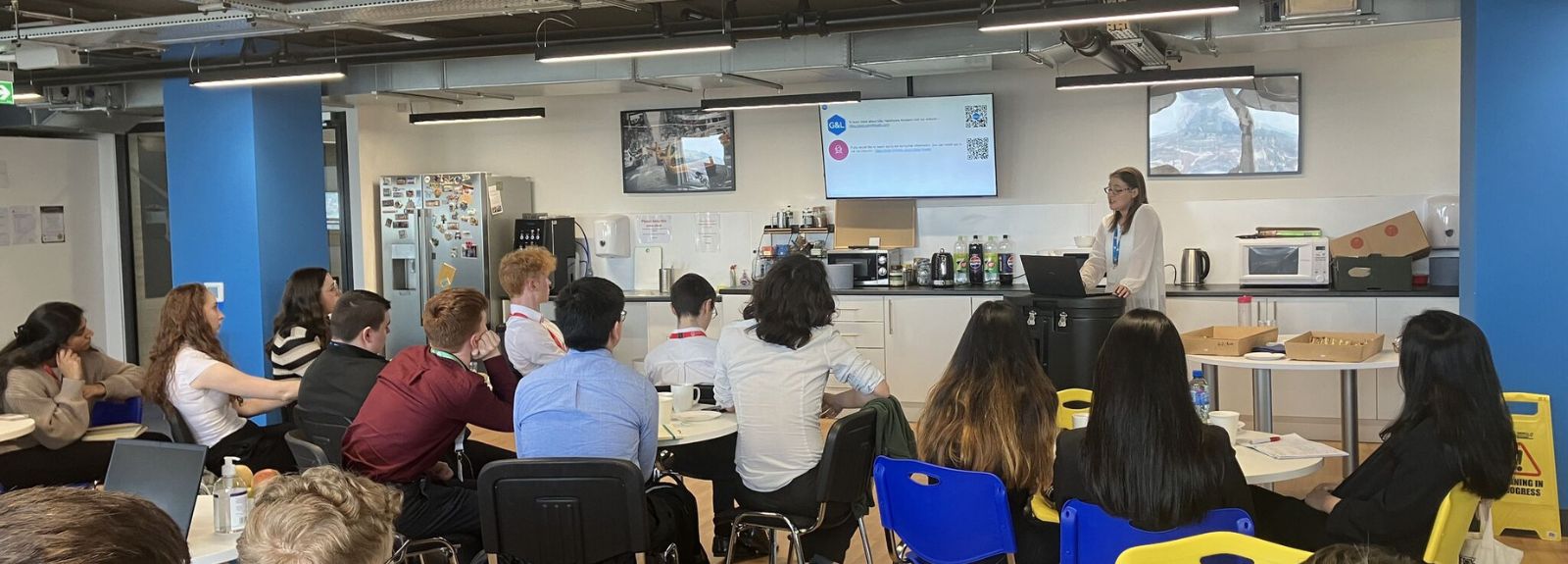 students at an employer location listening to a presentation